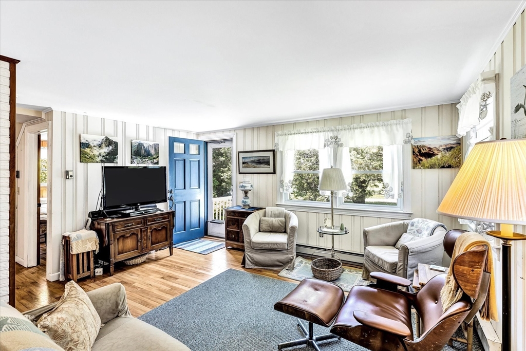 1 Carver Road Brewster, MA 02631 - Photo 5 of 33 a living room with furniture and a flat screen tv