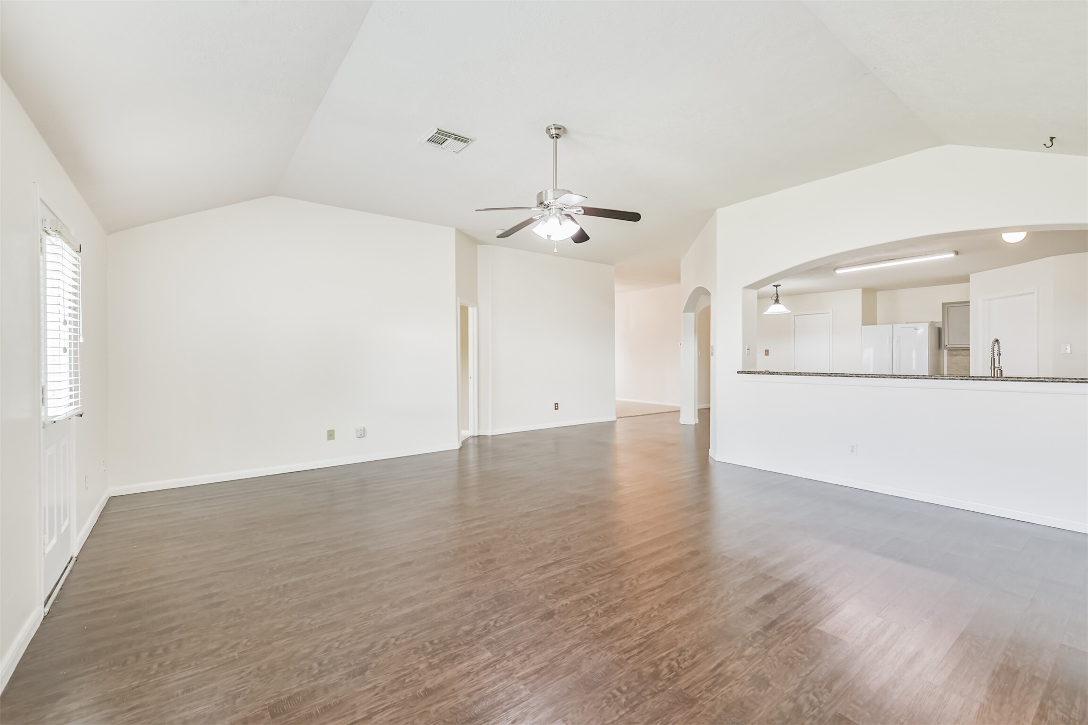 2415 Fox River Lane Spring, TX 77386 - Photo 11 of 34 a view of a kitchen with a sink and a refrigerator