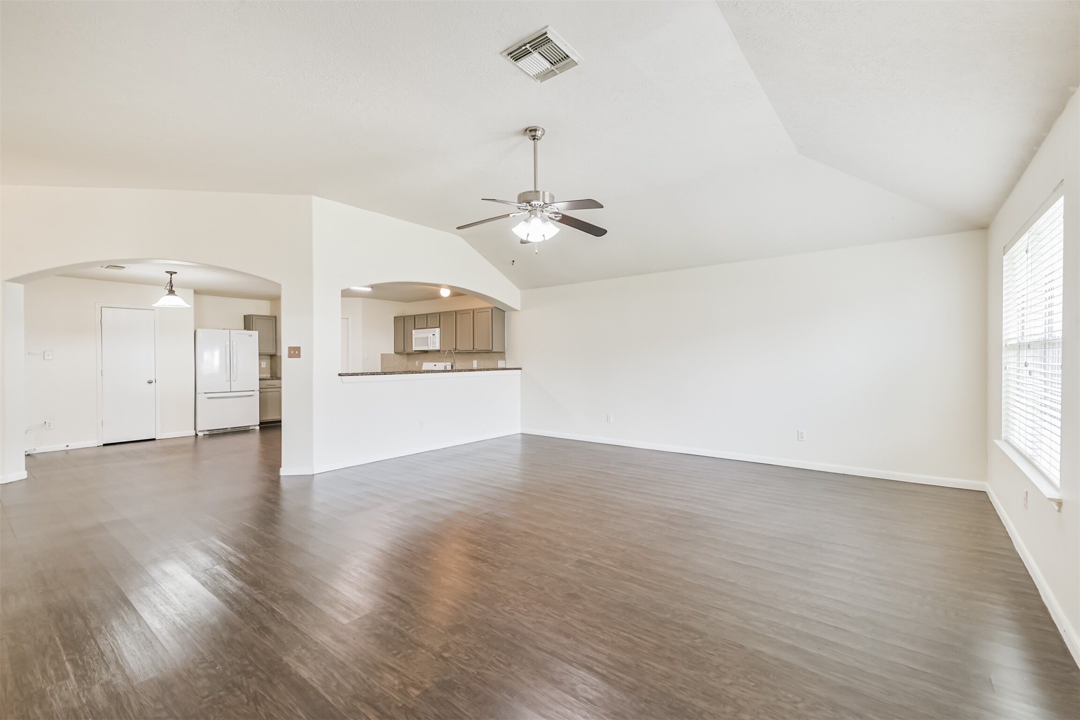 2415 Fox River Lane Spring, TX 77386 - Photo 12 of 34 wooden floor in an empty room with a window