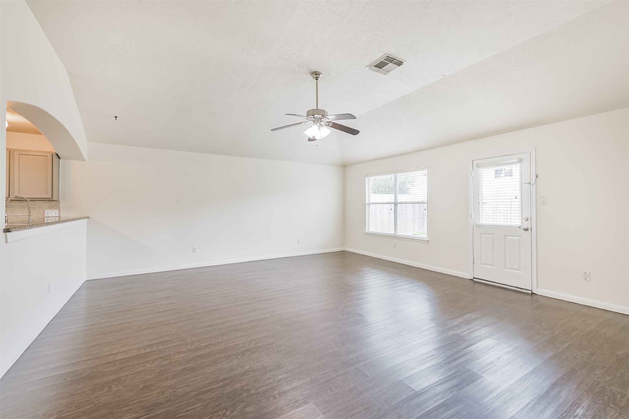 2415 Fox River Lane Spring, TX 77386 - Photo 13 of 34 wooden floor in an empty room with a window