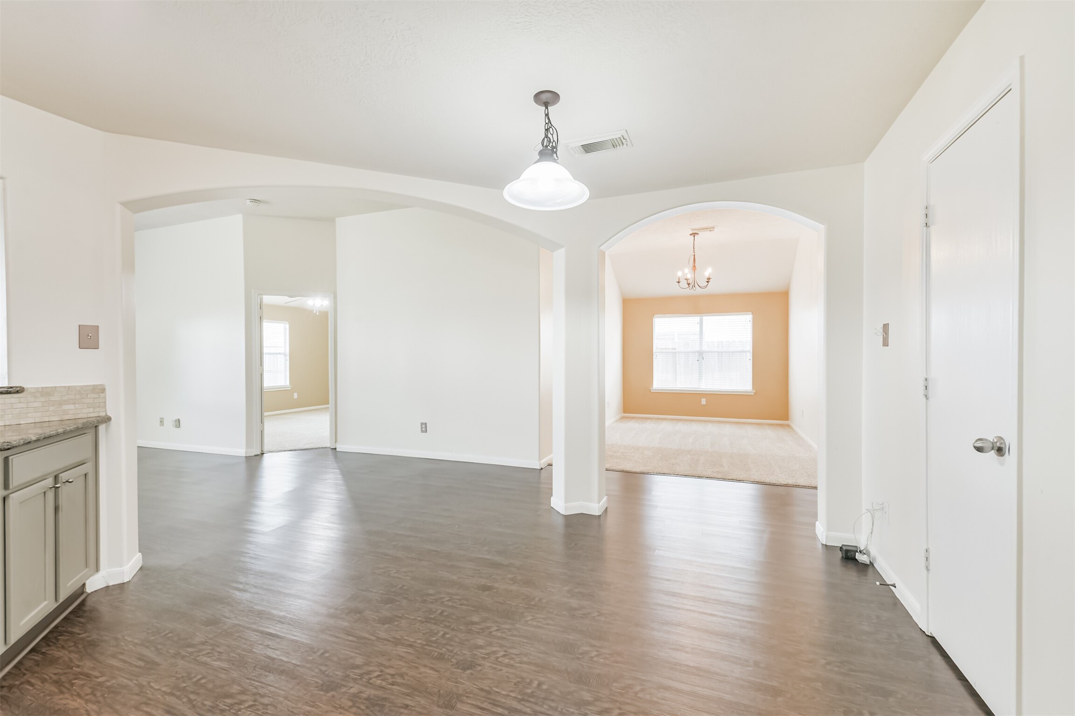 2415 Fox River Lane Spring, TX 77386 - Photo 14 of 34 a view of an empty room with wooden floor and a window