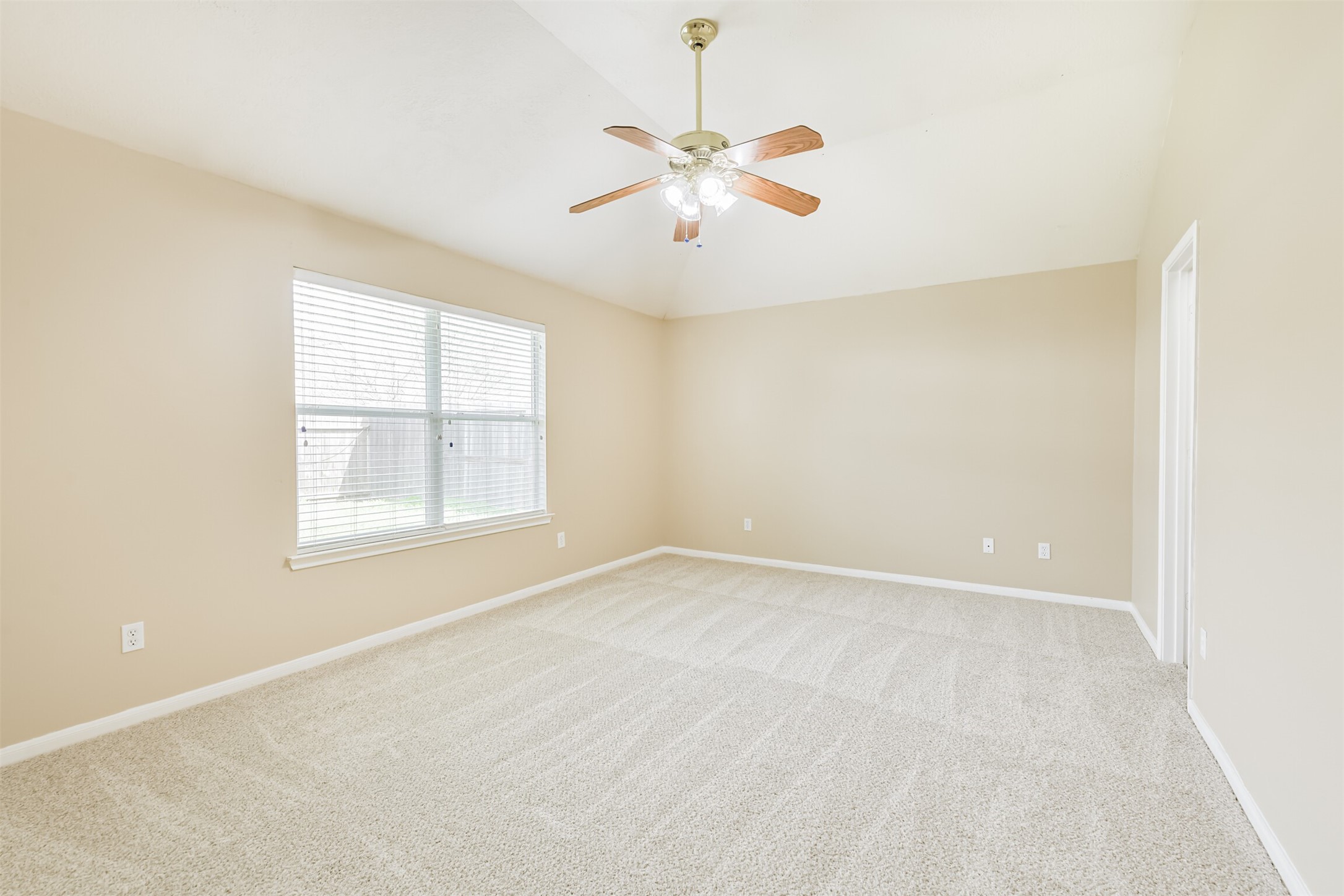 2415 Fox River Lane Spring, TX 77386 - Photo 17 of 34 an empty room with windows and fan