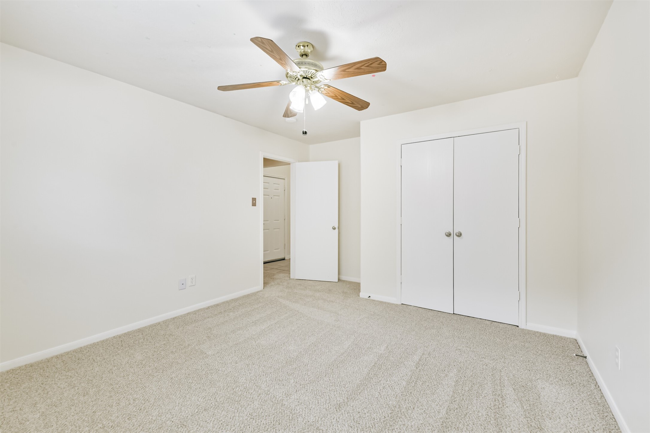 2415 Fox River Lane Spring, TX 77386 - Photo 28 of 34 an empty room with closet and ceiling fan