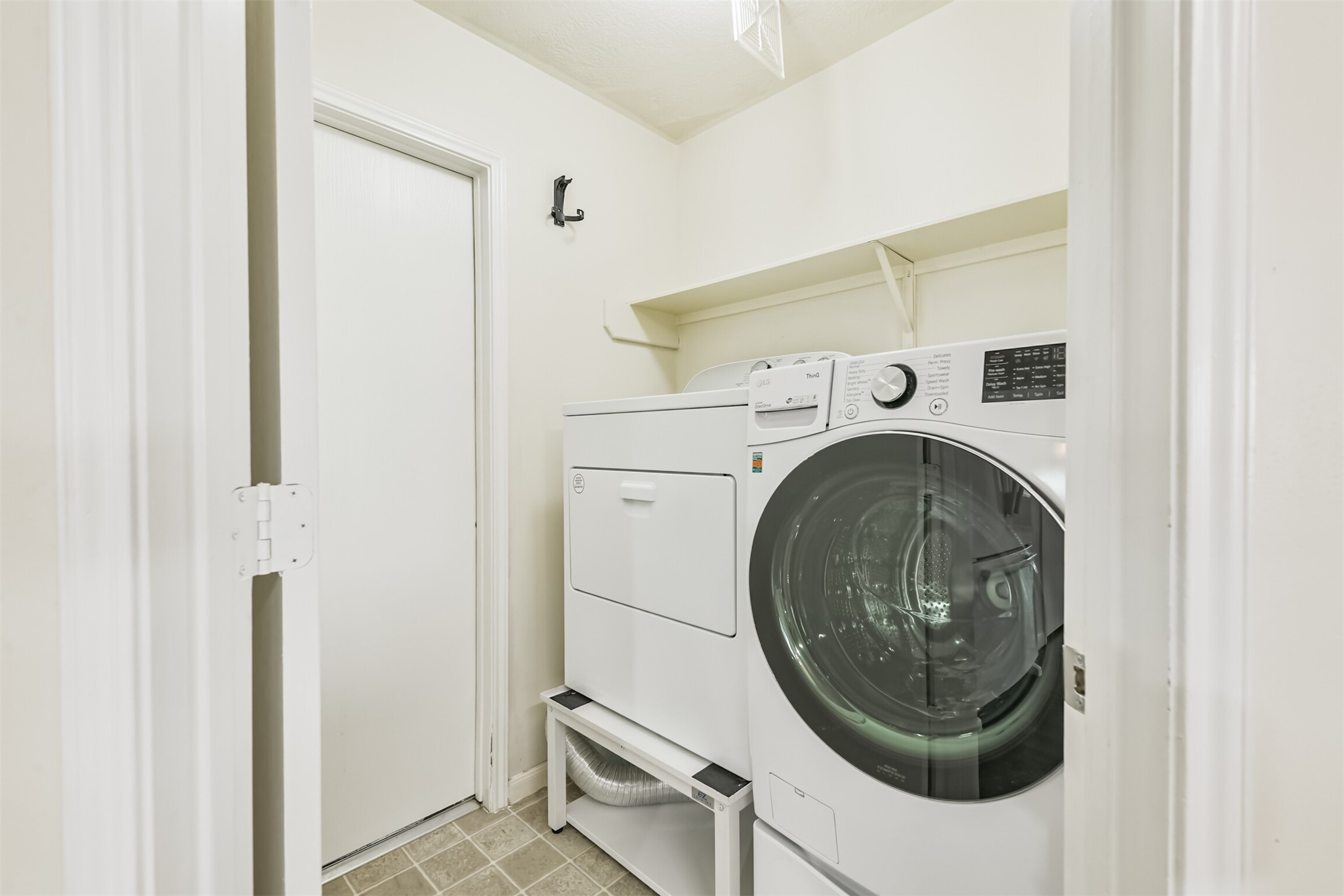 2415 Fox River Lane Spring, TX 77386 - Photo 30 of 34 a utility room with dryer and washer