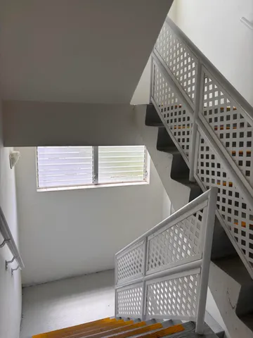 a view of a refrigerator in kitchen