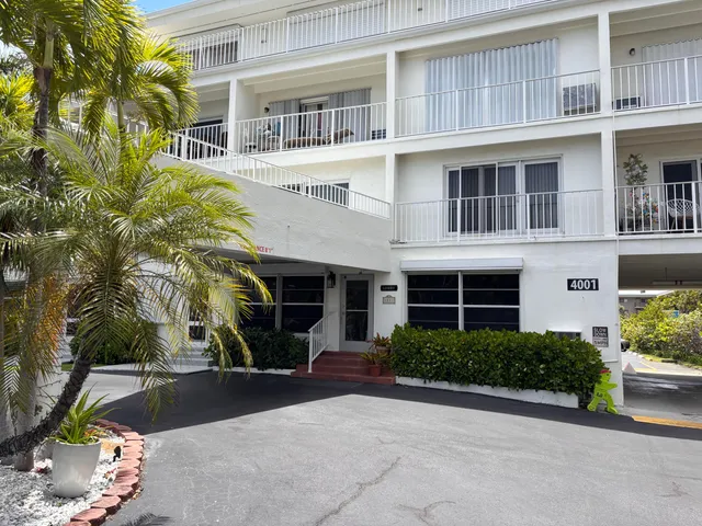 a view of a building with a yard