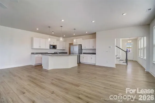 a view of kitchen with wooden floor