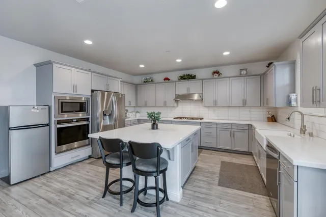 a bathroom with a sink toilet tub and shower
