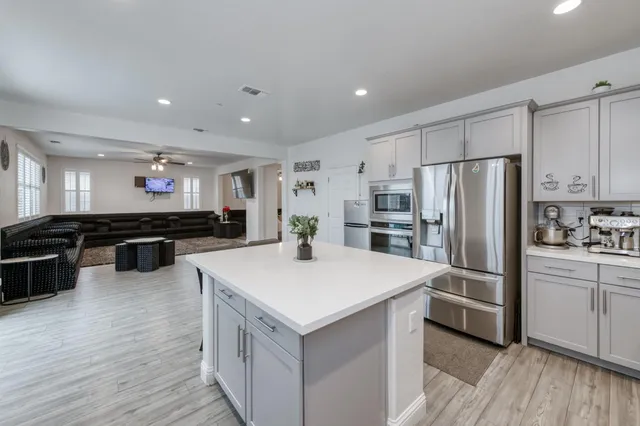 a bathroom with a sink toilet tub and shower