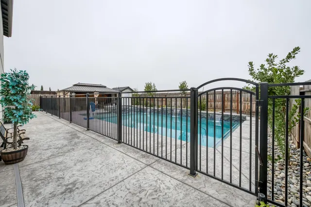 a view of swimming pool with a lounge chair