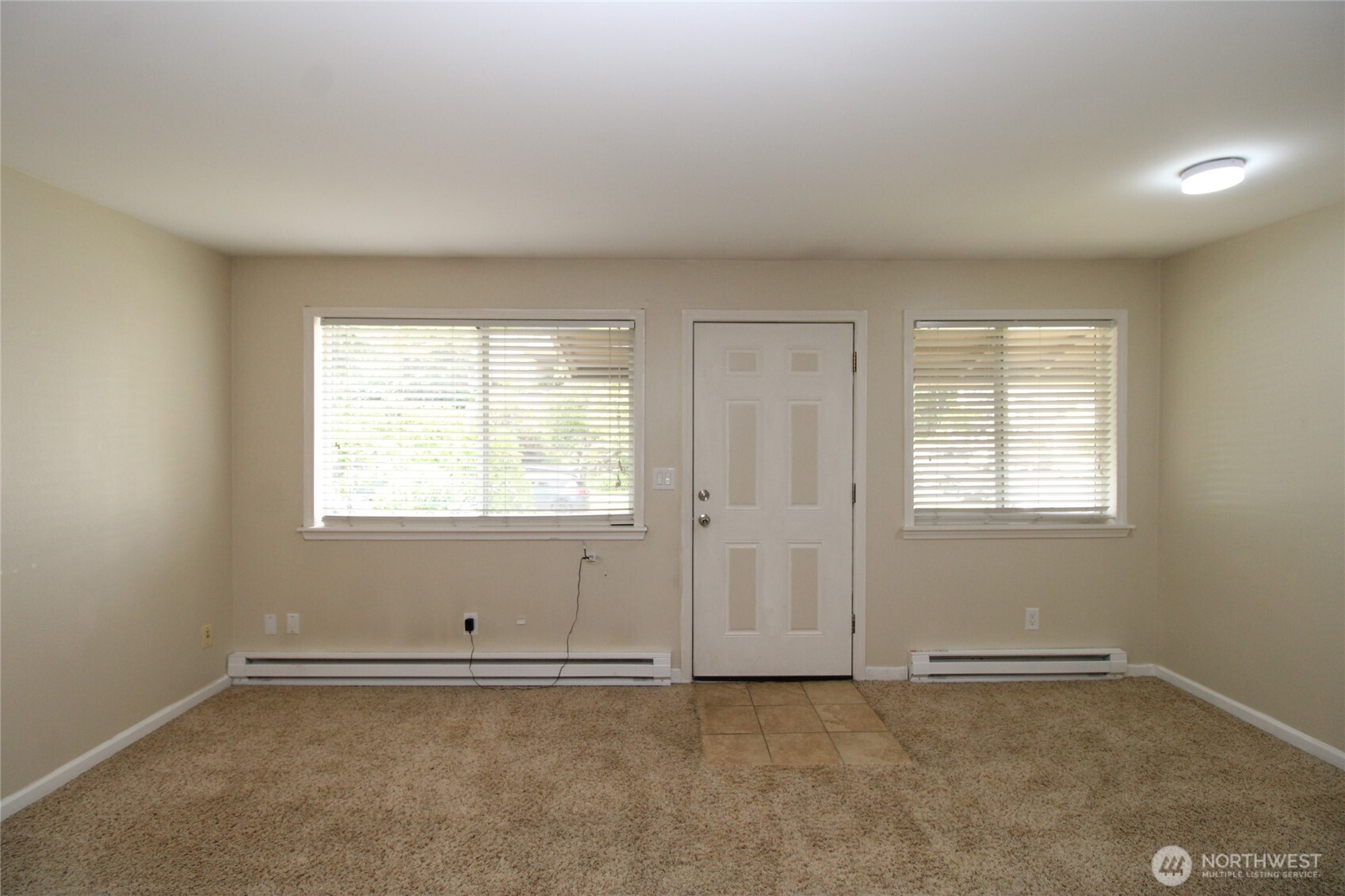 604 North 3rd Street, Unit 7 Tacoma, WA 98403 - Photo 2 of 12 an empty room with a window