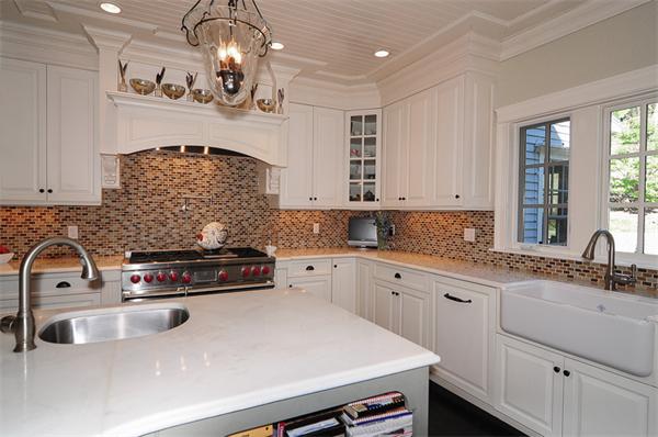 23 Suffolk Road Wellesley, MA 02481 - Photo 9 of 26 a kitchen with stainless steel appliances a sink stove and cabinets