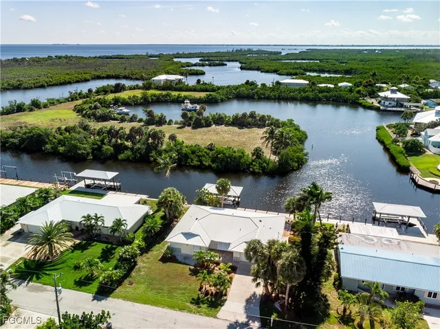 an aerial view of a house with a lake view