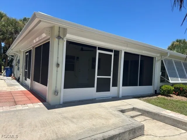 a view of a backyard with sitting area