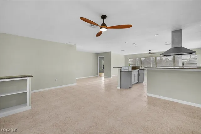 a view of a kitchen with a sink and cabinets
