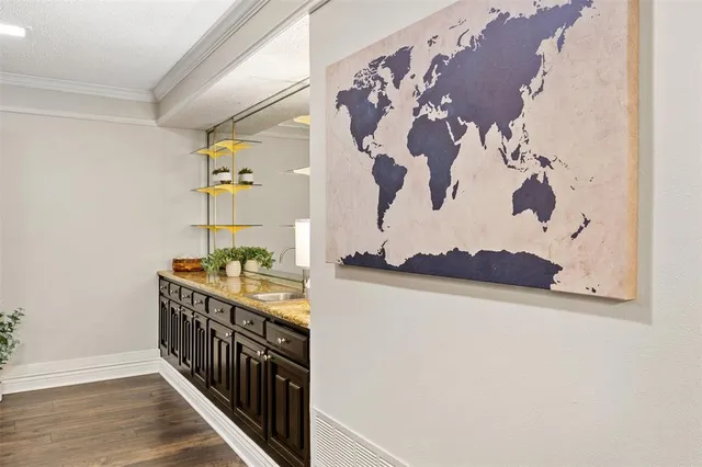 a view of a hallway with paintings on the wall