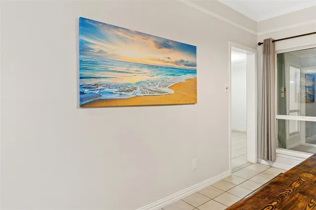 a view of a room with wooden floor and a window