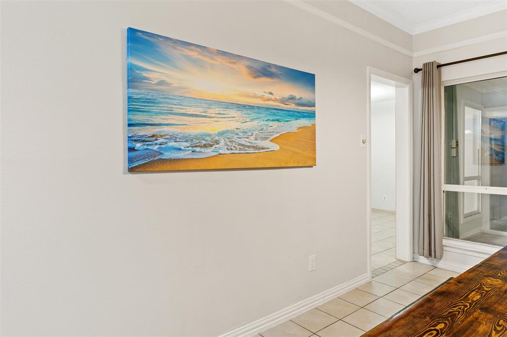 1105 East Spring Valley Road Richardson, TX 75081 - Photo 12 of 40 Hall featuring light tile patterned flooring, baseboards, and crown molding