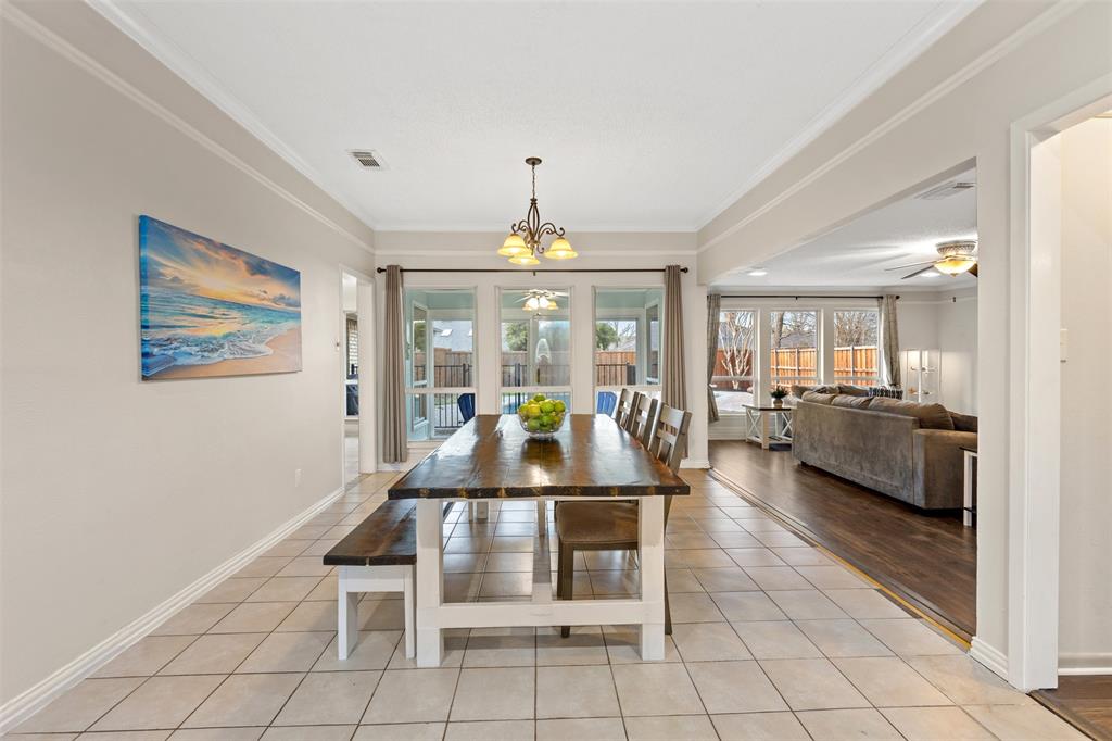 1105 East Spring Valley Road Richardson, TX 75081 - Photo 4 of 40 Dining room with light tile patterned flooring, ornamental molding, and visible vents