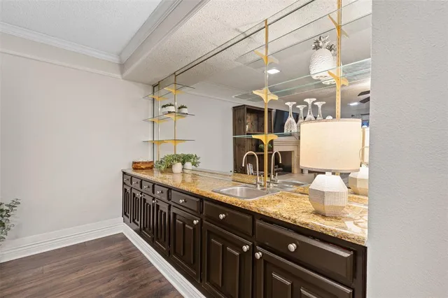 a bathroom with double vanity and a mirror