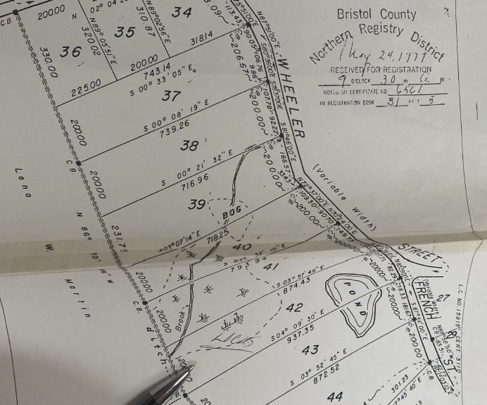 67 Wheeler Street Rehoboth, MA 02769 - Photo 5 of 5 a view of a bed with a white comforter