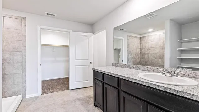 a view of an empty room and closet