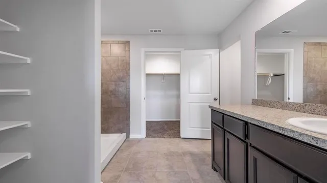 a kitchen with a sink and a refrigerator