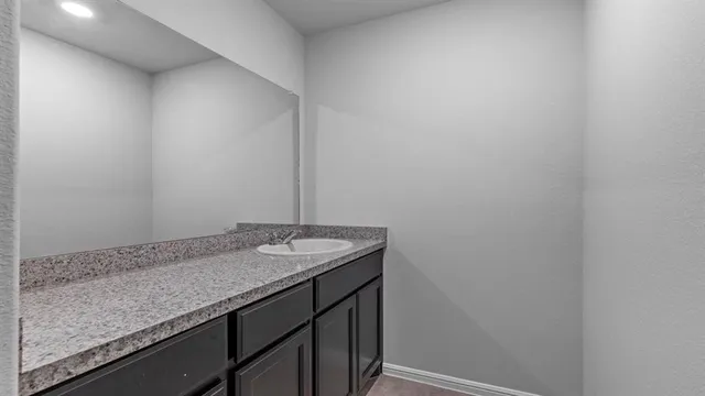 a white toilet sitting next to a bath tub