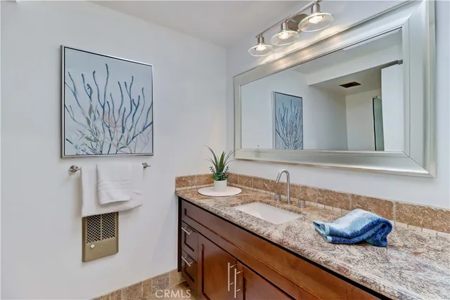 a bathroom with a shower and a sink