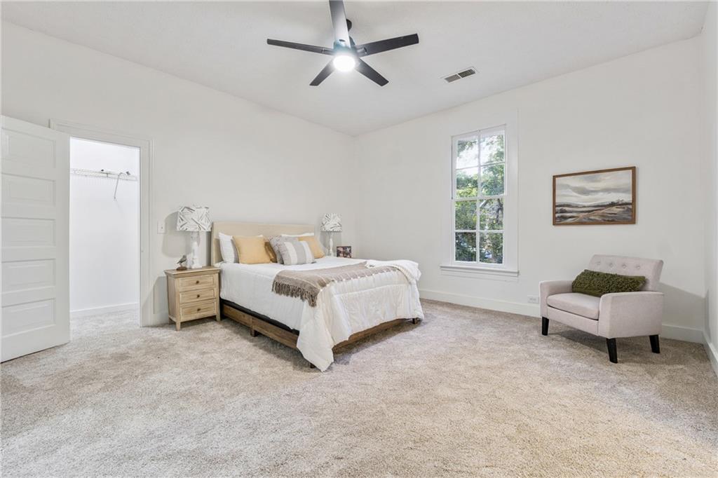 1820 Cassville Road Northwest Cartersville, GA 30121 - Photo 11 of 24 a bed room with a bed and a chair