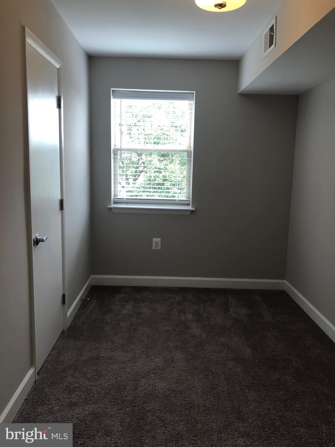 2647 Martin Luther King Jr Avenue Southeast, Unit 203 Washington, DC 20020 - Photo 11 of 28 an empty room with a window