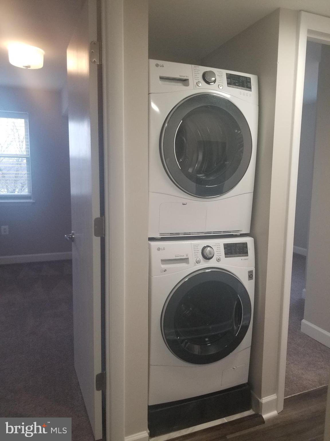 2647 Martin Luther King Jr Avenue Southeast, Unit 203 Washington, DC 20020 - Photo 16 of 28 a utility room with dryer and washer