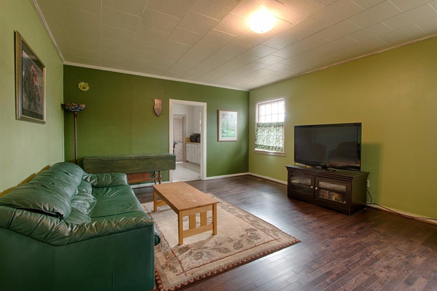 2712 Merriman Road Medford, OR 97501 - Photo 3 of 12 a living room with furniture and a flat screen tv
