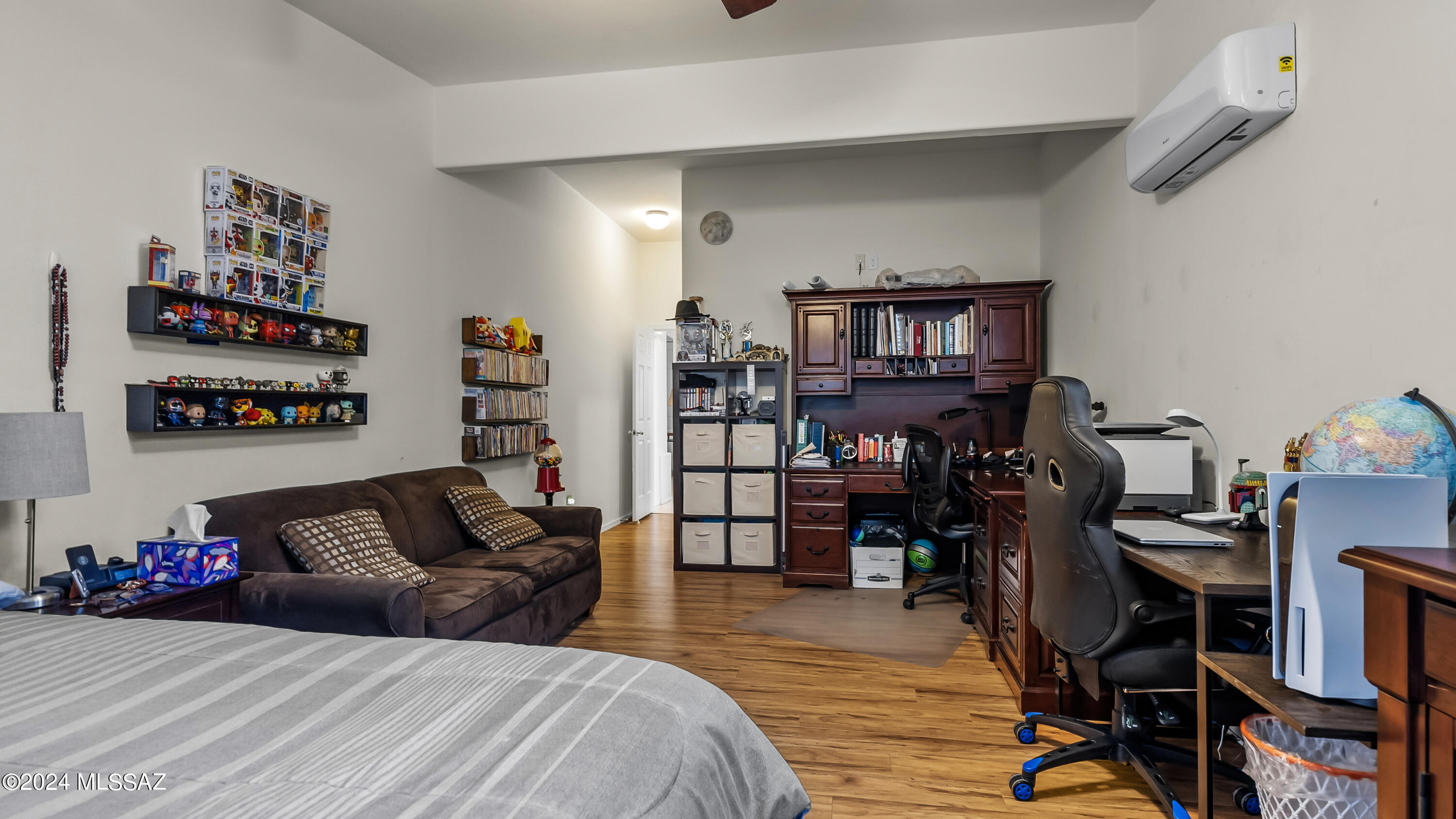 374 Via Capri Rio Rico, AZ 85648 - Photo 22 of 30 a bedroom with furniture and a wooden floor