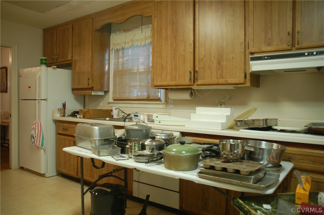 1213 Covington Road Colonial Heights, VA 23834 - Photo 11 of 33 a kitchen with a sink a stove and cabinets