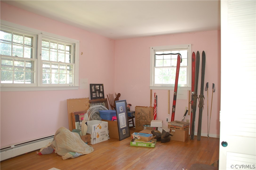 1213 Covington Road Colonial Heights, VA 23834 - Photo 20 of 33 a room with chair and wooden floor