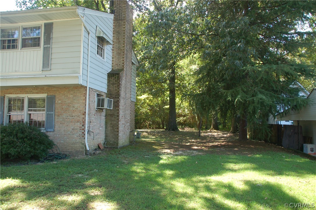1213 Covington Road Colonial Heights, VA 23834 - Photo 3 of 33 a view of a back yard of the house