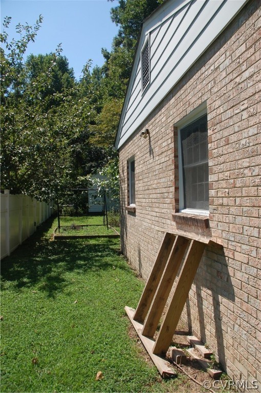 1213 Covington Road Colonial Heights, VA 23834 - Photo 4 of 33 a view of a backyard with a garden
