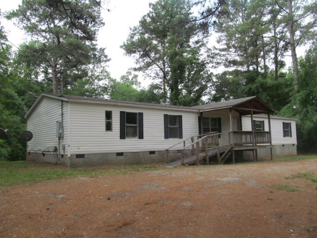 3152 Upper River Road Macon, GA 31211 - Photo 1 of 12 a view of a house with a yard