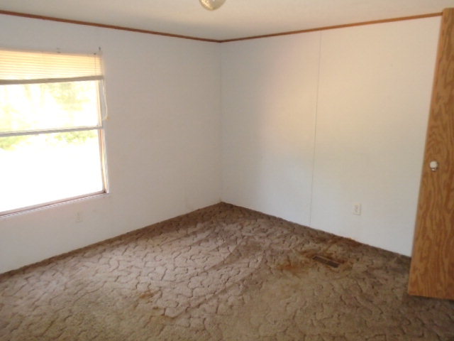 3152 Upper River Road Macon, GA 31211 - Photo 11 of 12 a view of an empty room with a window