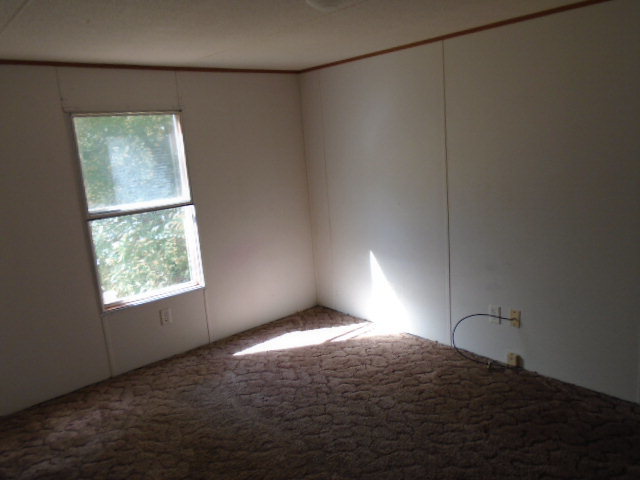 3152 Upper River Road Macon, GA 31211 - Photo 10 of 12 a bedroom with a bed and a window