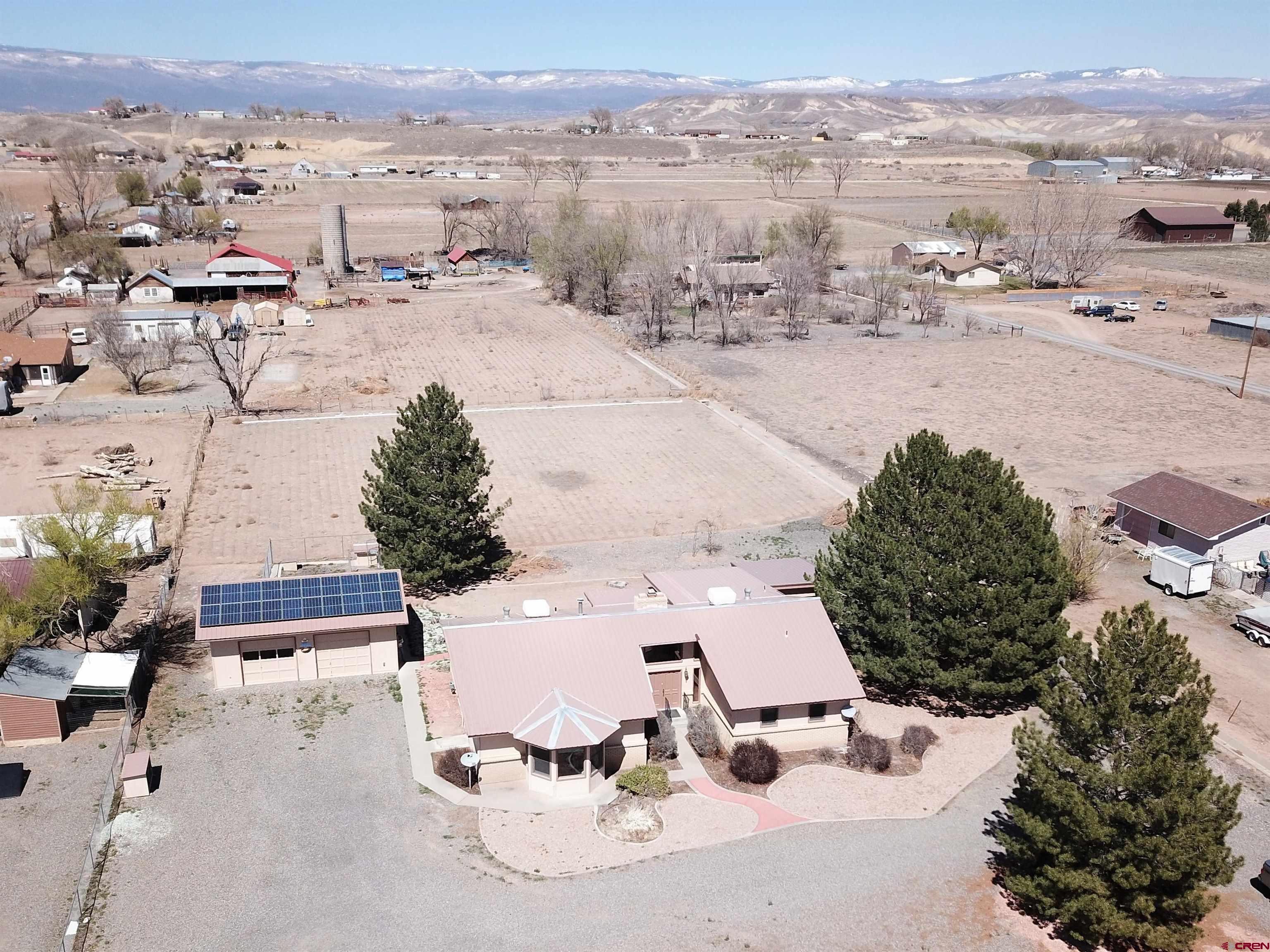 21061 Ivanhoe Road Austin, CO 81410 - Photo 19 of 24 an aerial view of a house with yard