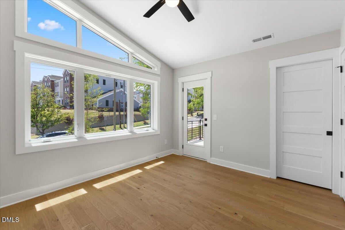 541 Bragg Street Raleigh, NC 27601 - Photo 29 of 44 a view of an empty room with a window and wooden floor