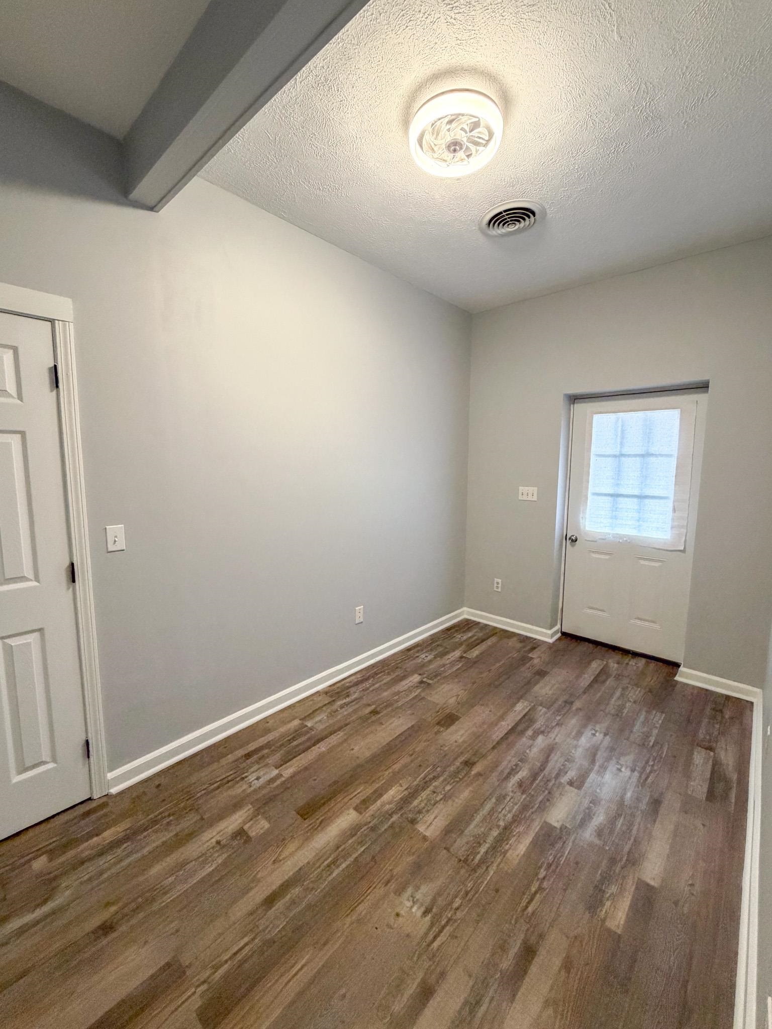 109 East Quitman Street Iuka, MS 38852 - Photo 2 of 6 an empty room with a window
