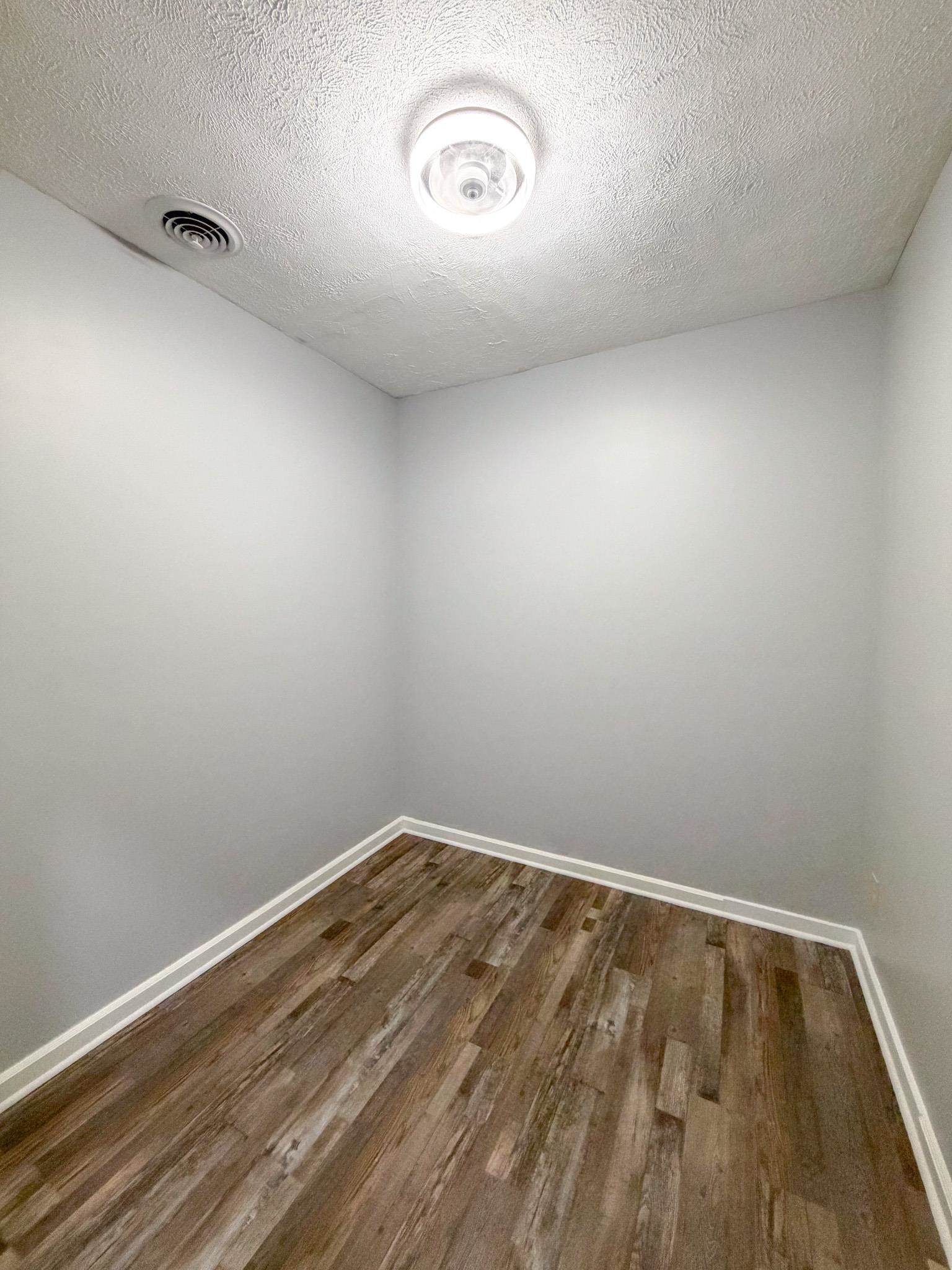 109 East Quitman Street Iuka, MS 38852 - Photo 4 of 6 a view of a room with wooden floor