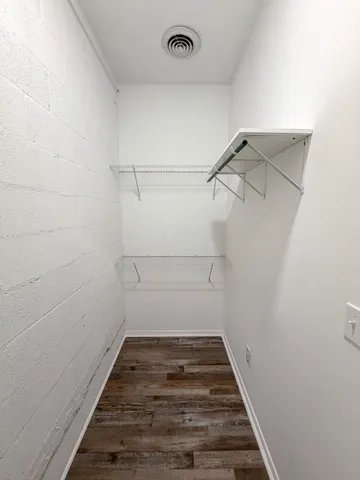 a view of a room with racks on the wall