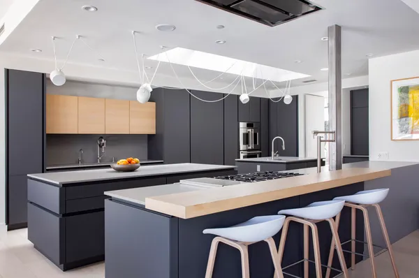 a kitchen with a sink cabinets and wooden floor