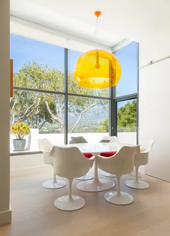 a view of a dining room with furniture window and outside view