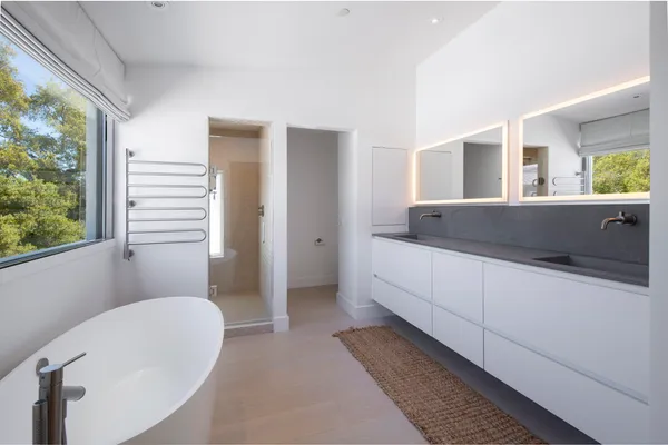 a bathroom with a bathtub and shower