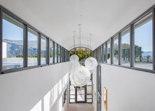 a view of a living room and entryway